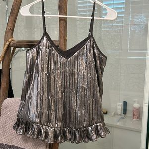Anthropologie silver sequin top with ruffle hem, size 4. New with tags.